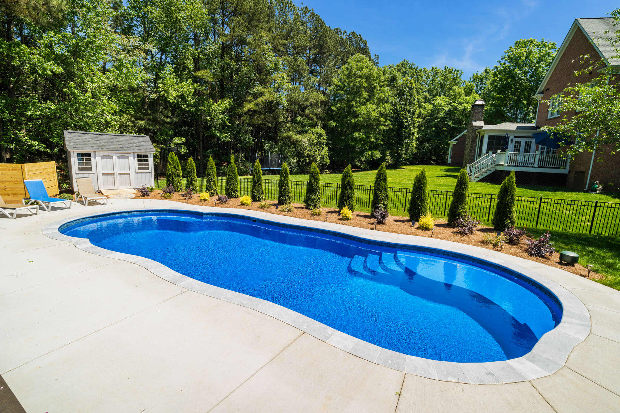 river pool install in an indiana homes backyard