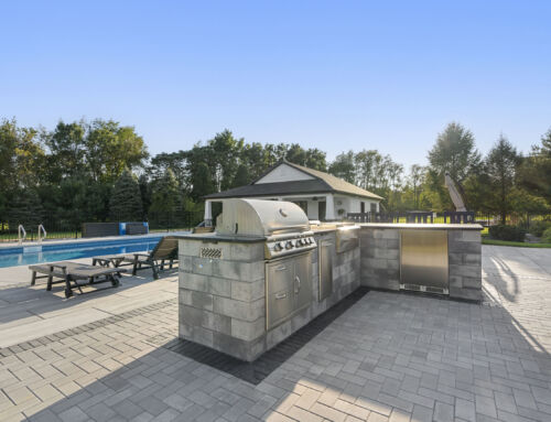 Elevate a Syracuse, IN Landscape Design with an Expansive Paver Patio and Luxurious Outdoor Kitchen